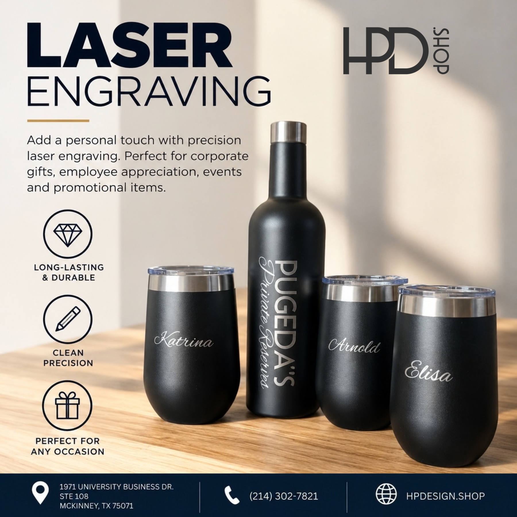 Engraved black bottle and tumblers on a wooden table