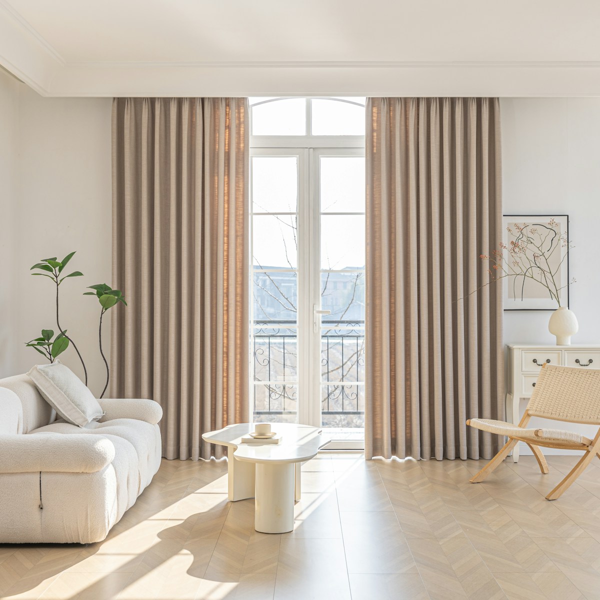 Elevated living room with layered neutral furnishings and warm editorial styling