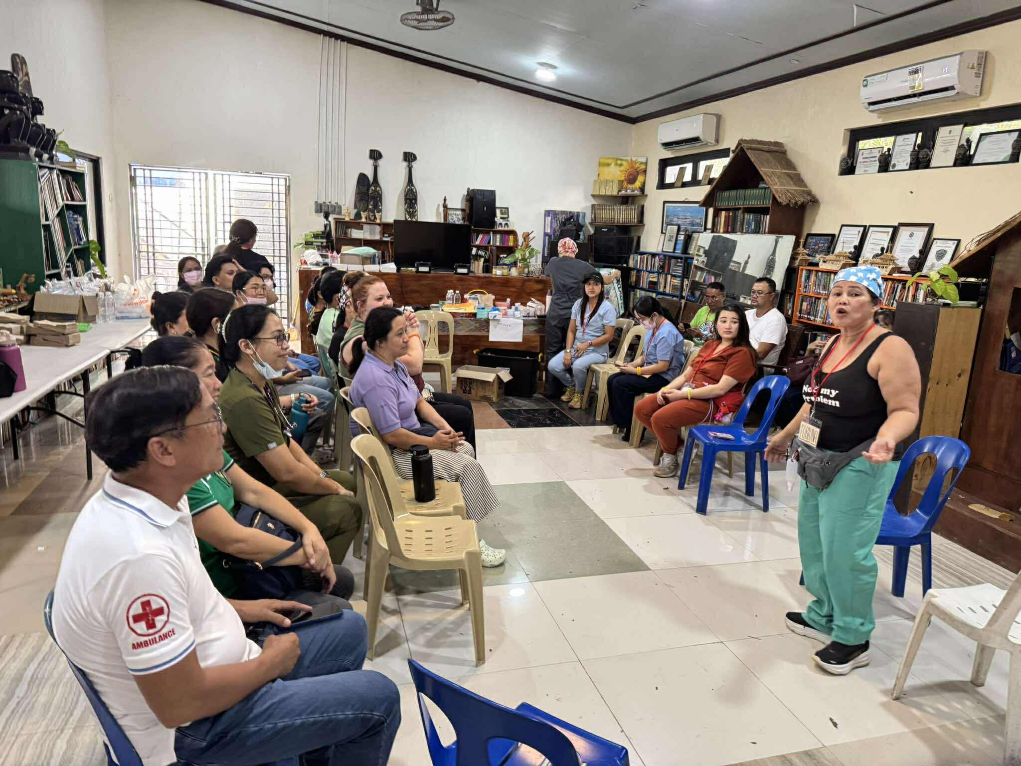 Mission team gathered for a pre-clinic briefing in the Philippines