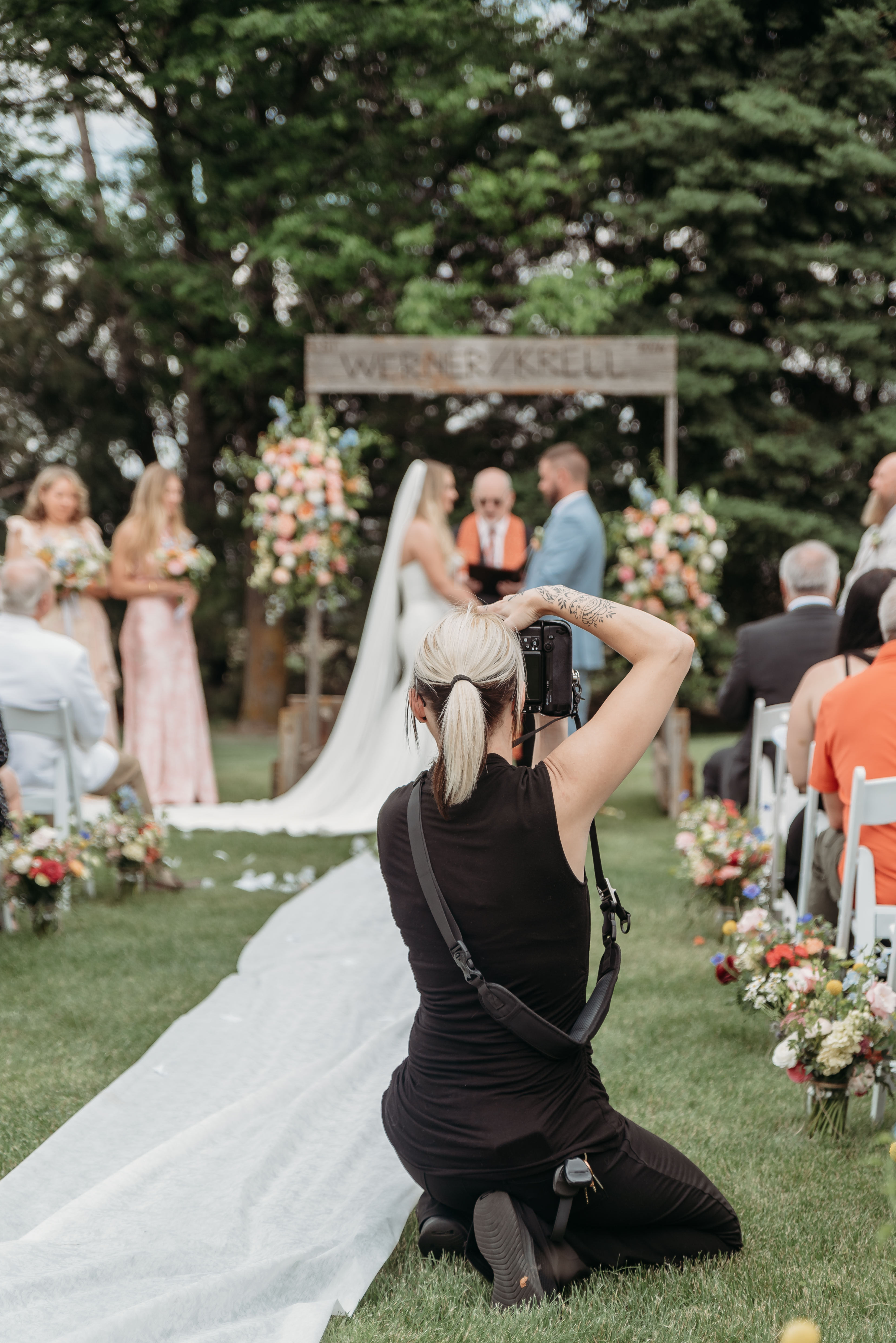 Brittany McClain photographing a wedding ceremony