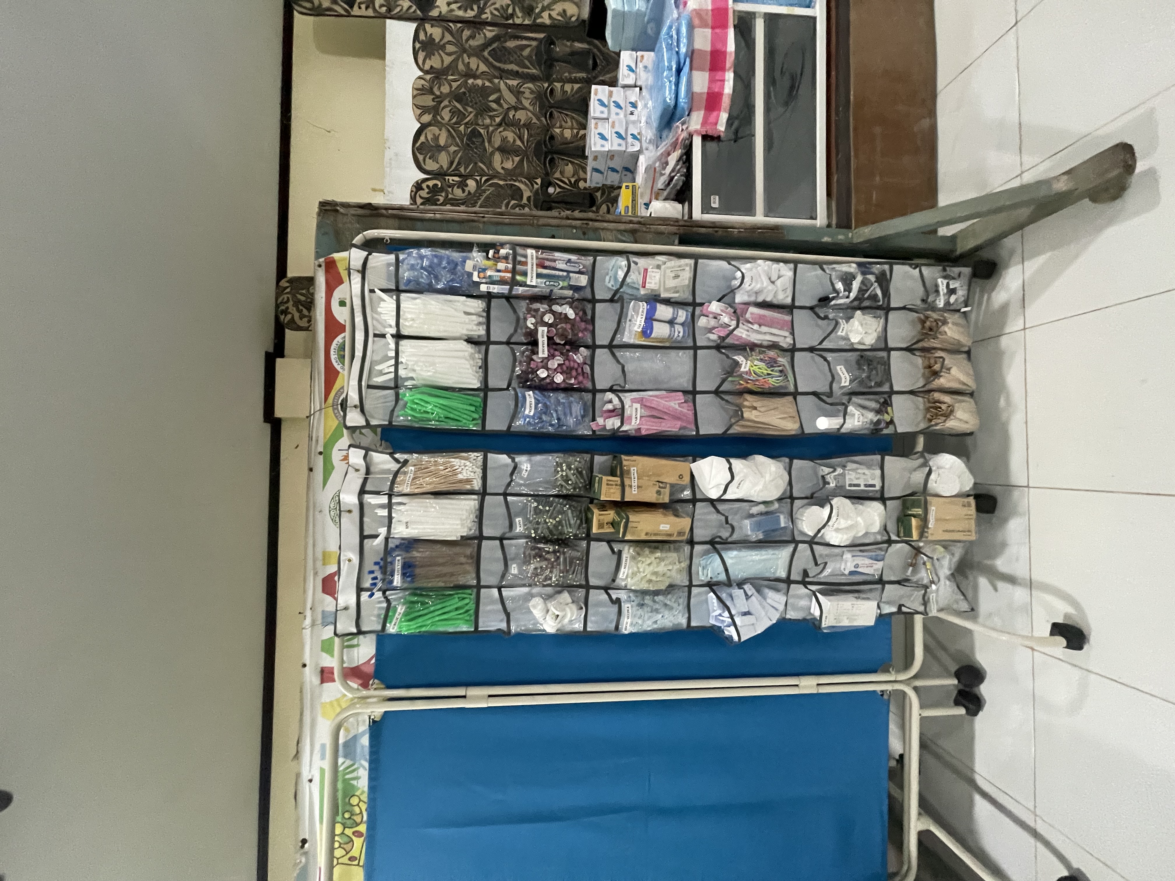 Organized dental supplies and privacy screens prepared for mission care