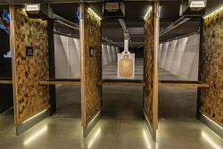 Indoor live-fire lanes set for a structured handgun training session.